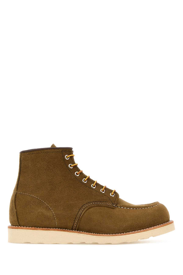 Red Wing Exterior: 100% Suede; Interior: 100% Leather; Sole: Rubber boot in brown
