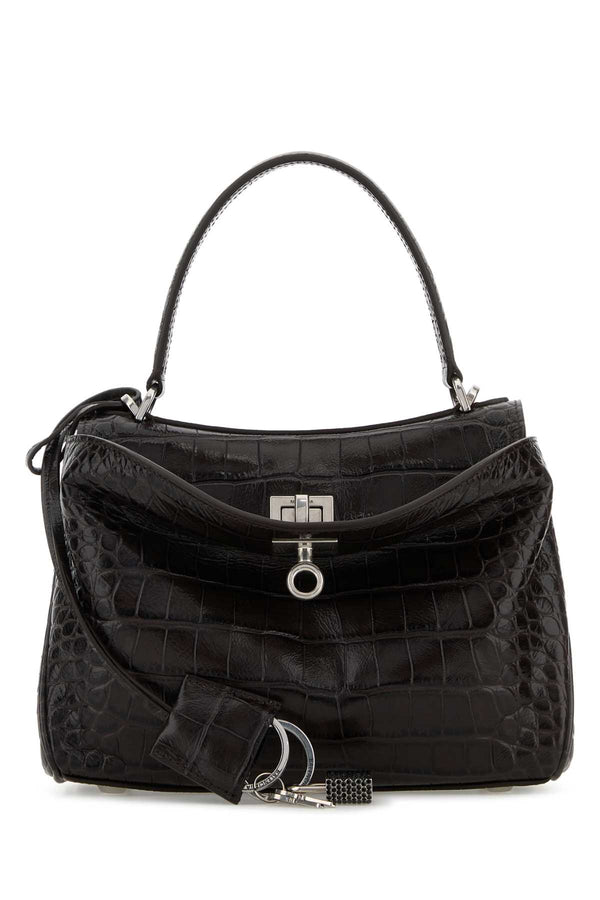Balenciaga Handle Exterior: 100% Calf Lining: 100% Nappa leather Finishing: Silver metal top handle bag in black