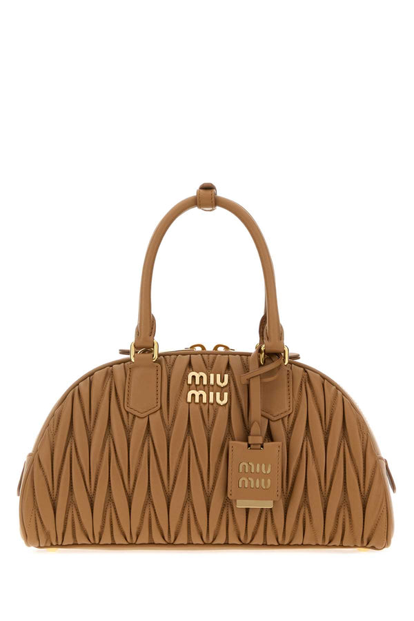 Miu Miu Exterior: 100% Nappa leather; Lining: 100% Fabric; Finishing: Golden metal shoulder bag in caramel