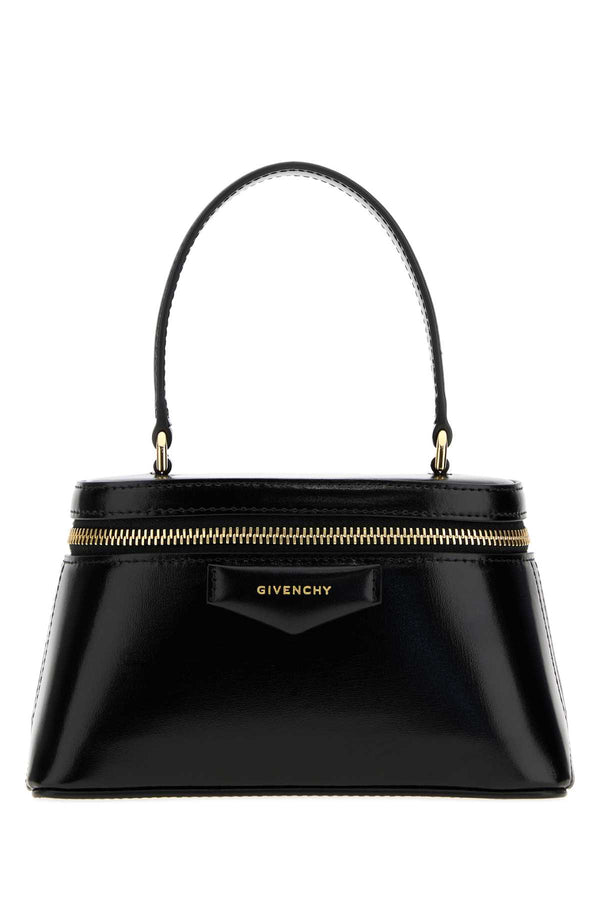 Givenchy Exterior: 100% Calf Lining: 100% Nappa leather Finishing: Golden metal top handle bag in black
