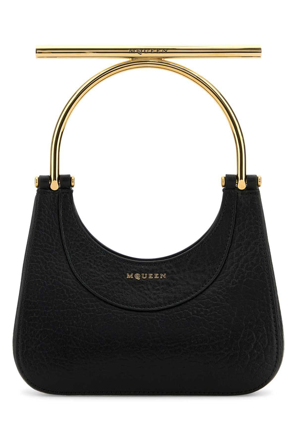 Alexander McQueen Exterior: 100% Lamb Lining: 100% Nappa leather Finishing: Golden metal shoulder bag in black