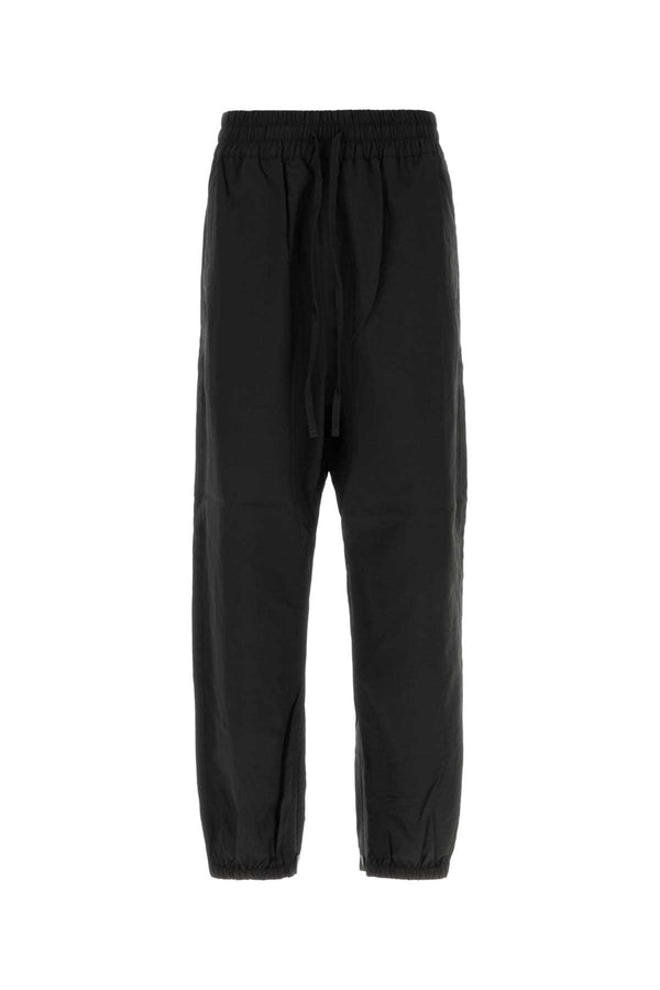 Fear Of God Track Exterior: 63% Recycled nylon 37% Nylon joggers in black