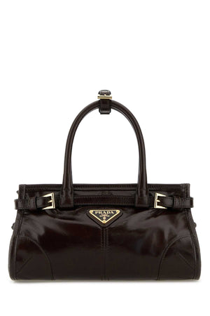 Prada Mano Exterior: 100% Leather top handle bag in brown