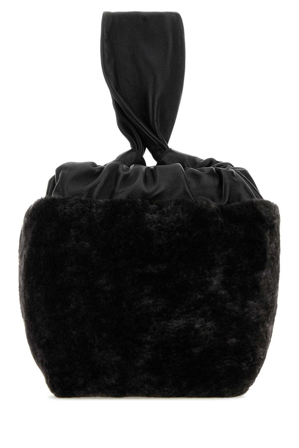Jil Sander Exterior: 100% Shearling clutch in black