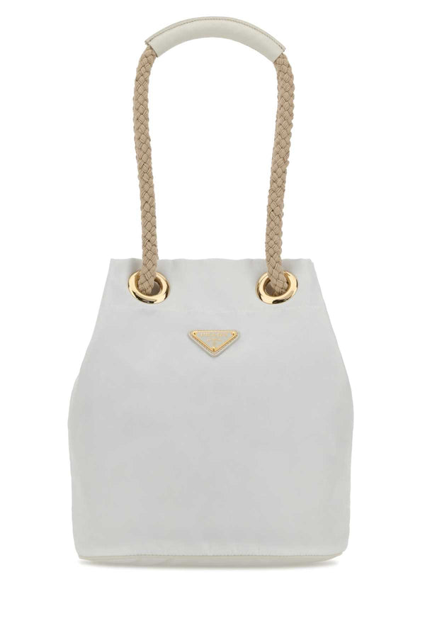 Prada Exterior: 100% Fabric (Re-Nylon); Interior: 100% Fabric; Finishing: Golden metal bucket bag in white