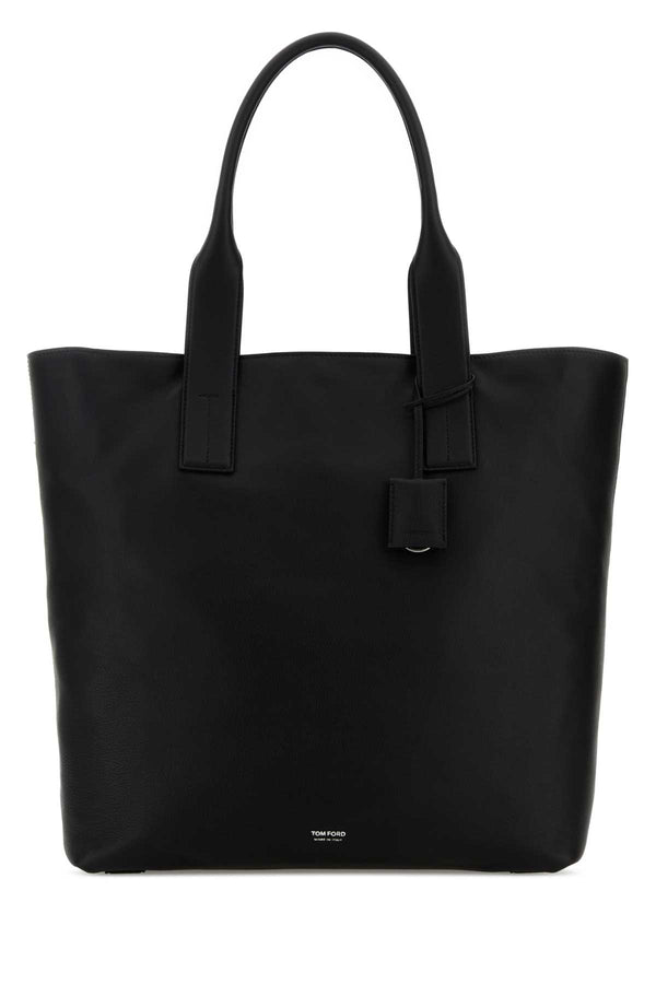 Tom Ford Leather Exterior: 100% Calf; Lining: 100% Fabric; Finishing: Silver metal tote bag in black