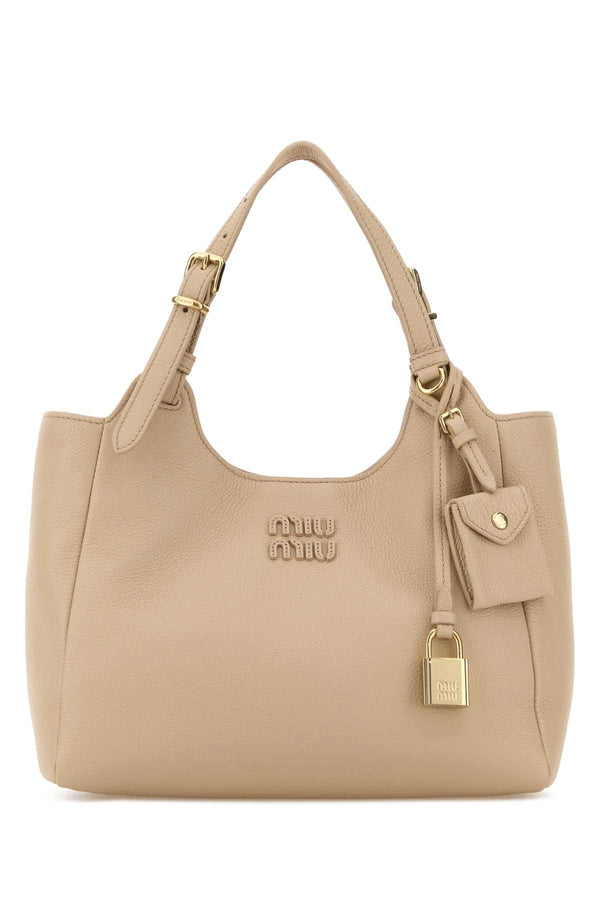 Miu Miu Exterior: 100% Leather; Lining: 100% Fabric; Finishing: Golden metal shoulder bag in beige