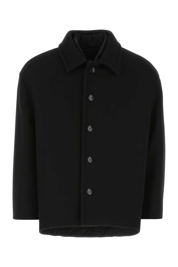Valentino Garavani Exterior: 73% Virgin wool 27% Nylon. Lining: 100% Nylon coat in black