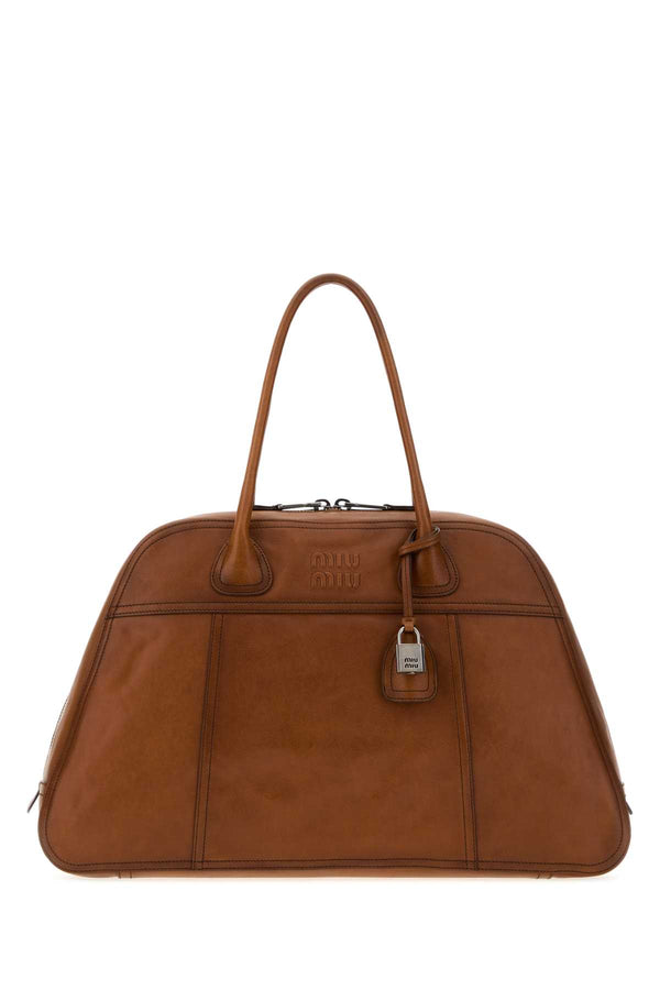 Miu Miu Exterior: 100% Calf Lining: 100% Fabric Finishing: Silver metal shoulder bag in brown