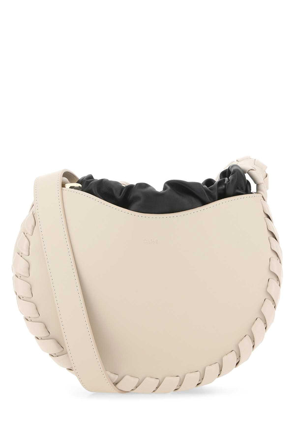 Chloé Tracolla Exterior: 100% Calf Lining: 100% Leather Finishing: Platinum crossbody bag in pink