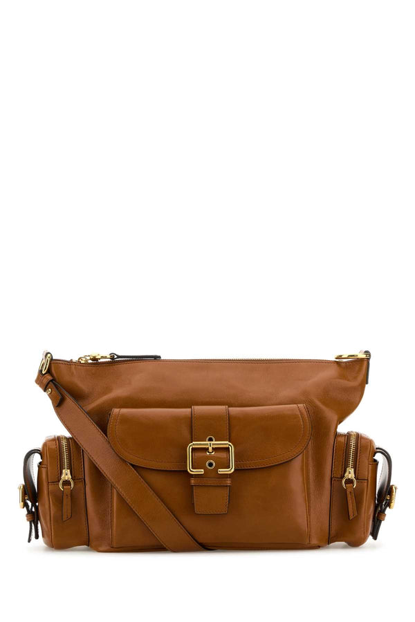 Chloé Camera Exterior: 100% Calf Lining: 54% Cotton 46% Linen Finishing: Golden metal shoulder bag in brown