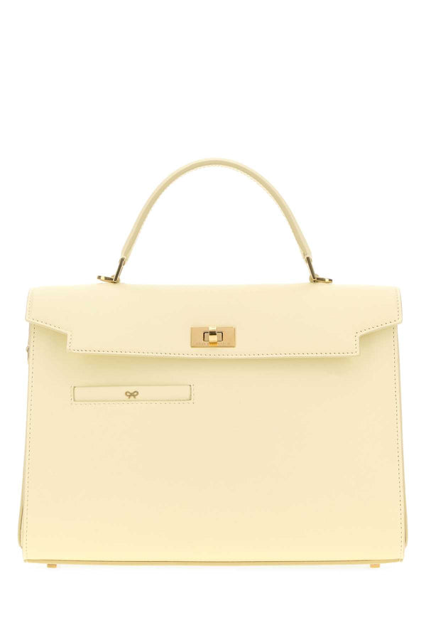 Anya Hindmarch Silky Exterior: 100% Calf top handle bag in yellow