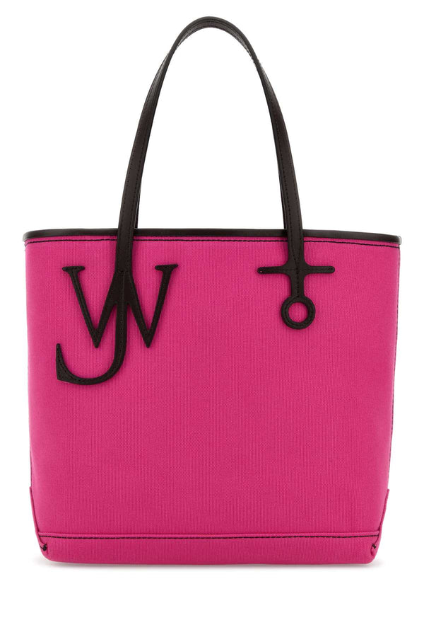 JW Anderson Anchor Outer: 100% cotton / Trim: 100% full grain calf leather / Hardware: 100% zamak tote bag in pink