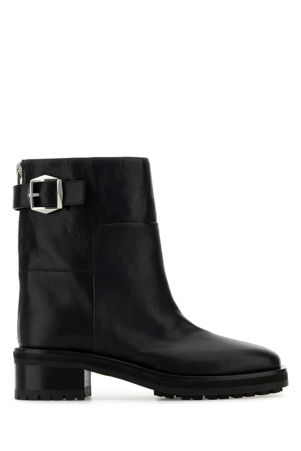 Jimmy Choo Exterior: 100% Calf. Interior: 100% Leather. Sole: Rubber ankle boot in black