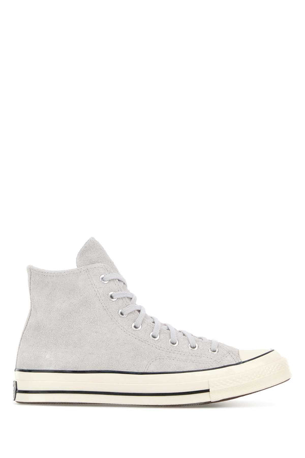 Converse Exterior: 100% Leather; Interior: 100% Fabric; Sole: Rubber sneaker in gray
