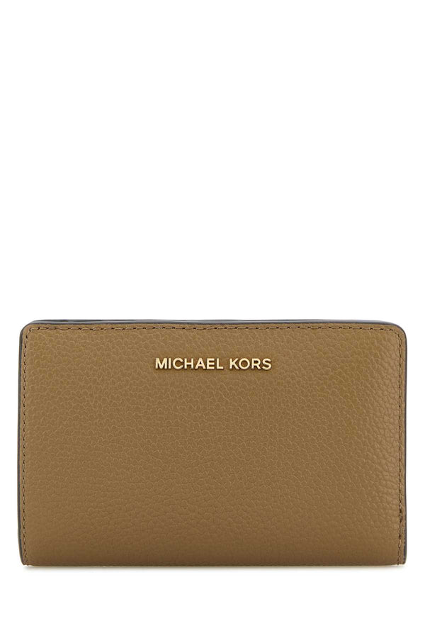 Michael By Michael Kors Exterior: 100% Leather Finishing: Golden metal wallet in beige