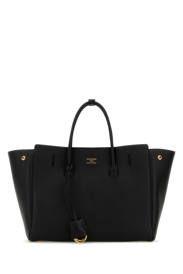 Balenciaga Exterior: 100% Calf Lining: 100% Leather Finishing: Golden metal top handle bag in black