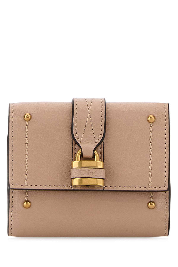 Chloé Trifold Exterior: 100% Leather; Finishing: Antiqued golden metal wallet in beige
