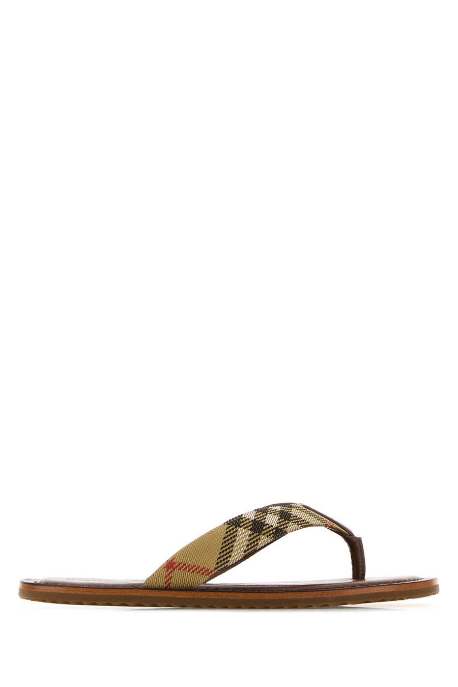 Burberry Exterior: 100% Fabric; Interior: 100% Leather; Sole: Rubber thong sandal in beige