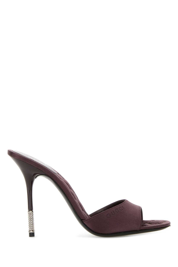 Gucci Upper Exterior: 100% Fabric; Interior: 100% Fabric; Sole: Leather mule heel in purple