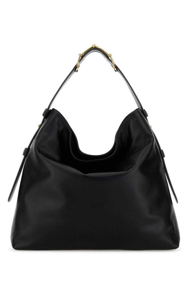 Gucci Exterior: 100% Leather; Lining: 100% Fabric; Finishing: Golden metal shoulder bag in black