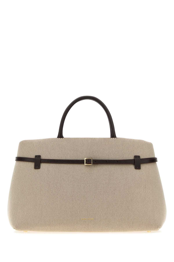 Manu Atelier Cambon Exterior: 100% Fabric; Lining: 100% Fabric; Finishing: Golden metal top handle bag in beige