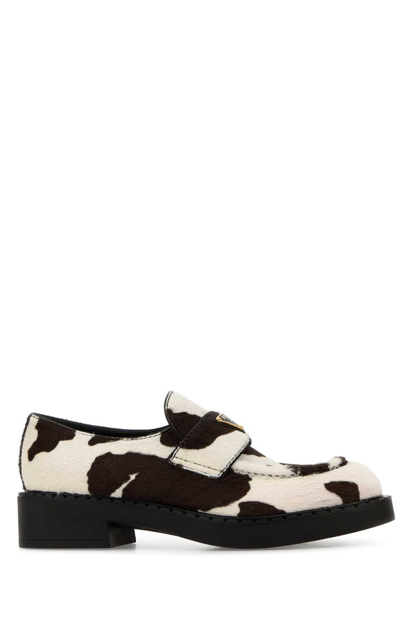Prada Exterior: 100% Leather; Interior: 100% Leather; Sole: Rubber loafer in white