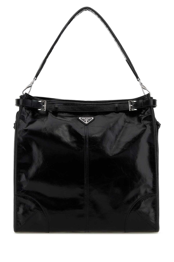 Prada Exterior: 100% Leather; Lining: 100% Fabric; Finishing: Silver metal shoulder bag in black