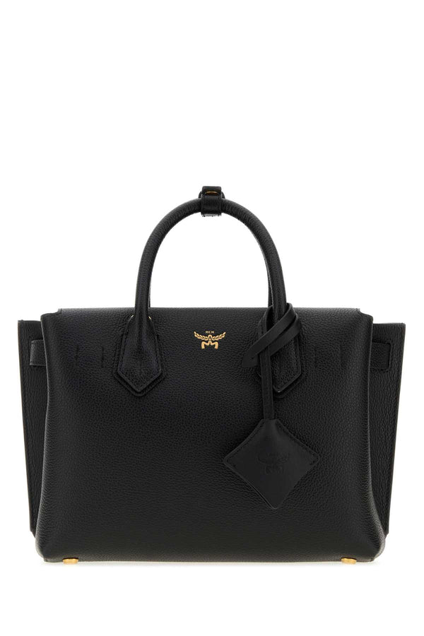 MCM Lthr Exterior: 100% Leather; Lining: 100% Fabric; Finishing: Golden metal tote bag in black