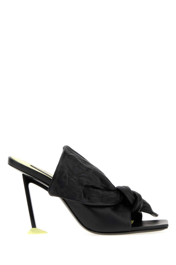 Givenchy Exterior: 100% Lamb Leather; Lining: 100% Leather; Sole: Rubber and leather sandal in black