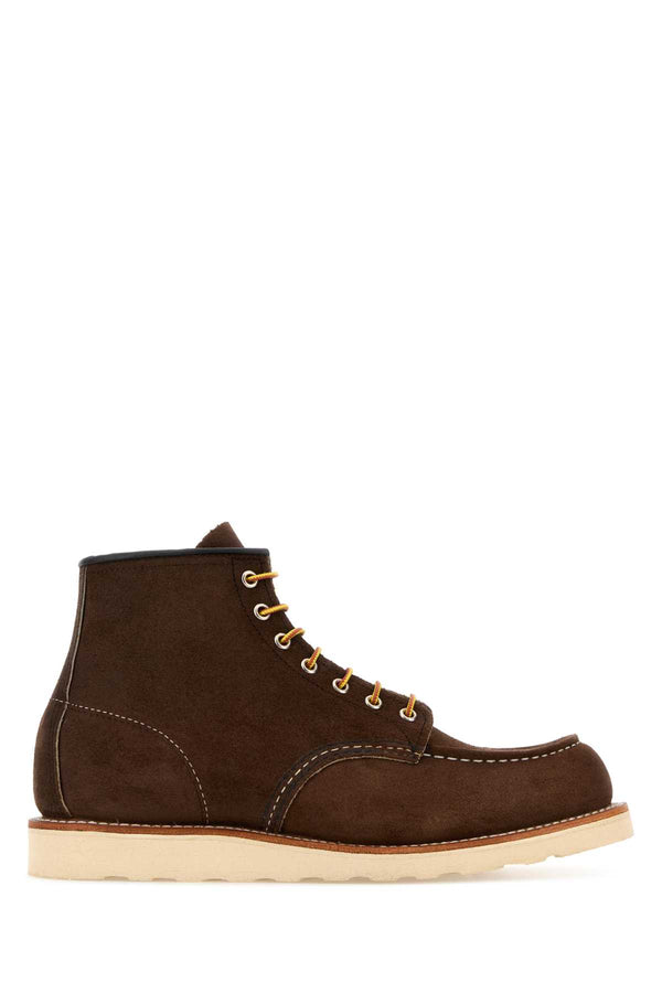 Red Wing Exterior: 100% Suede; Interior: 100% Leather; Sole: Rubber boot in brown