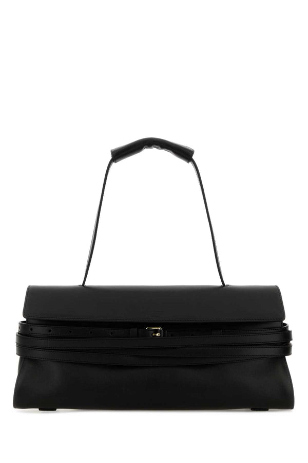 Moschino Exterior: 100% Nappa leather. Lining: 100% Fabric. Finishing: Golden metal shoulder bag in black