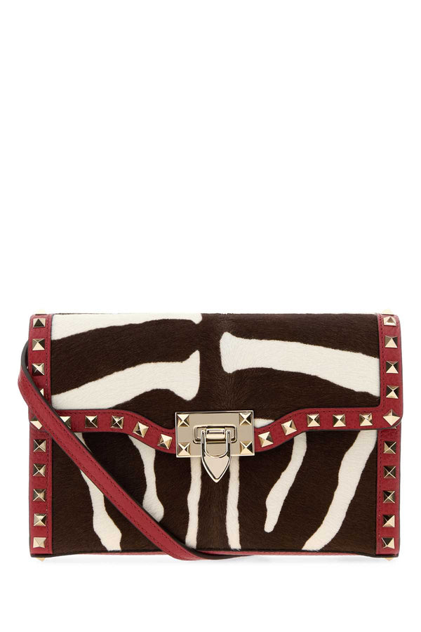 Valentino Garavani Shoulder Exterior: 100% Leather; Lining: 100% Suede; Finishing: Silver metal crossbody bag in red