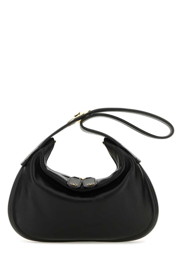 Valentino Garavani Exterior: 100% Nappa leather; Lining: 100% Leather; Finishing: Golden metal shoulder bag in black