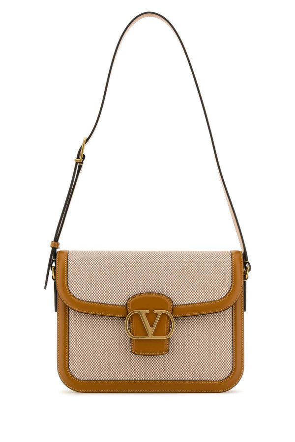 Valentino Garavani Exterior: Canvas and Leather; Lining: Nappa Leather; Hardware: Gold-tone metal shoulder bag in beige