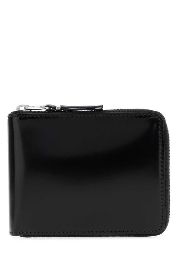 Comme des Garçons Inside Exterior: 100% Leather; Finishing: Silver metal wallet in black