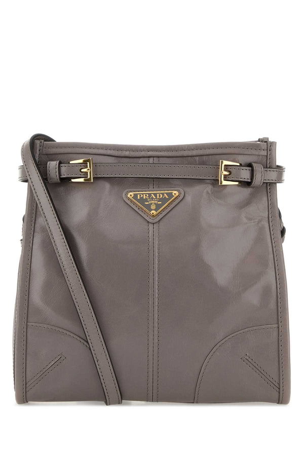 Prada Exterior: 100% Leather; Lining: 100% Fabric; Finishing: Golden metal crossbody bag in gray