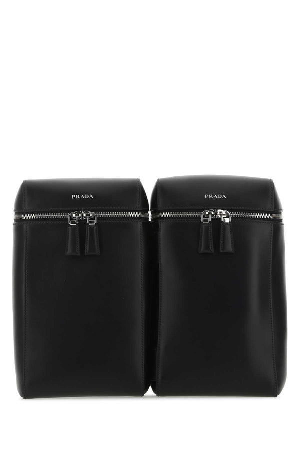 Prada Exterior: 100% Calf; Lining: 100% Fabric; Finishing: Silver metal backpack in black