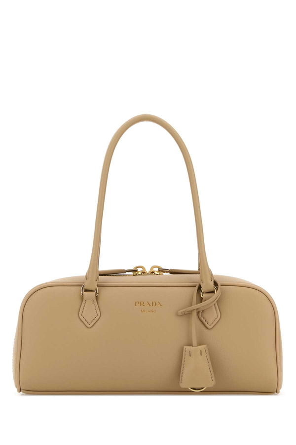 Prada Exterior: 100% Leather; Lining: 100% Fabric; Finishing: Golden metal shoulder bag in beige