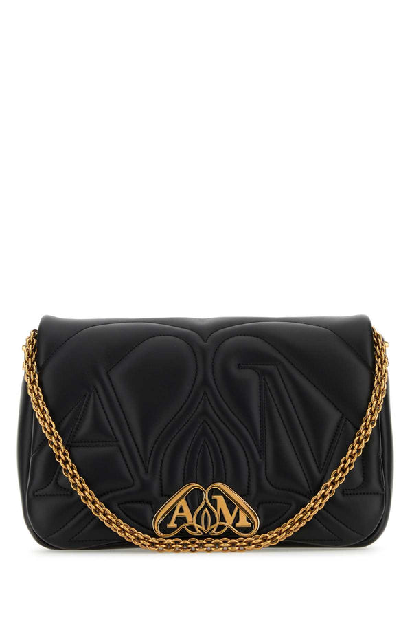 Alexander McQueen Exterior: 100% Lamb; Lining: 100% Lamb; Finishing: Antiqued golden metal shoulder bag in black