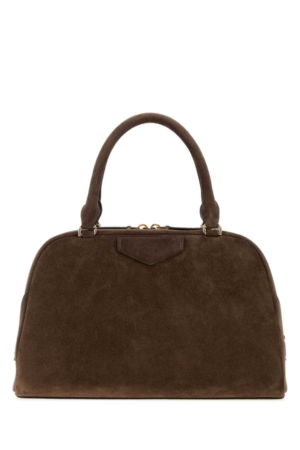Givenchy Exterior: 100% Suede; Lining: 100% Fabric; Finishing: Golden metal top handle bag in brown