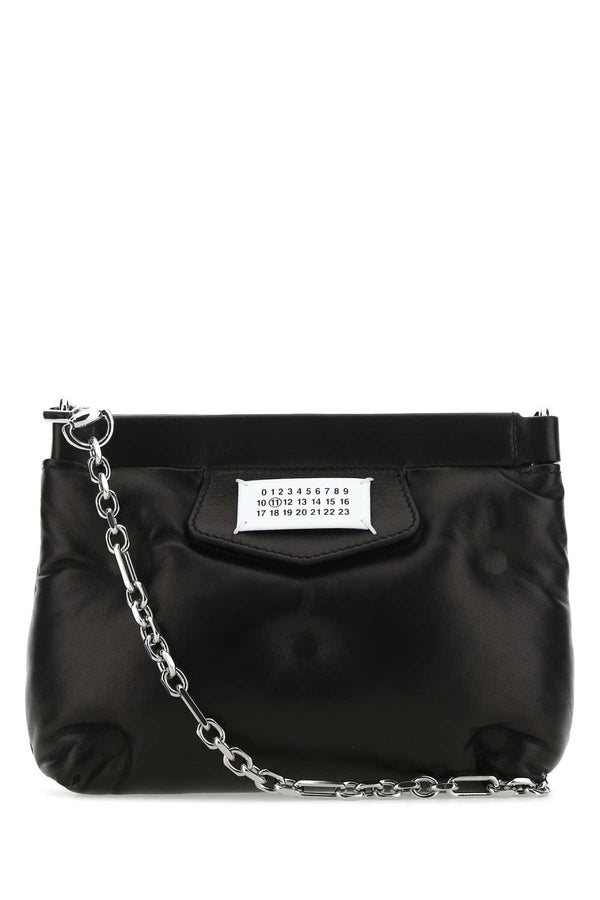 Maison Margiela Body: 100% Sheep Leather; Patch: 100% Cow Leather; Lining: 100% Polyester; Interior: 100% Sheep Leather; Hardware: 60% Brass clutch in black