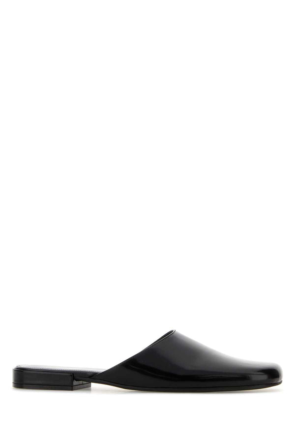 The Row Mule Exterior: 100% Calf; Interior: 100% Leather; Sole: Rubber mule in black