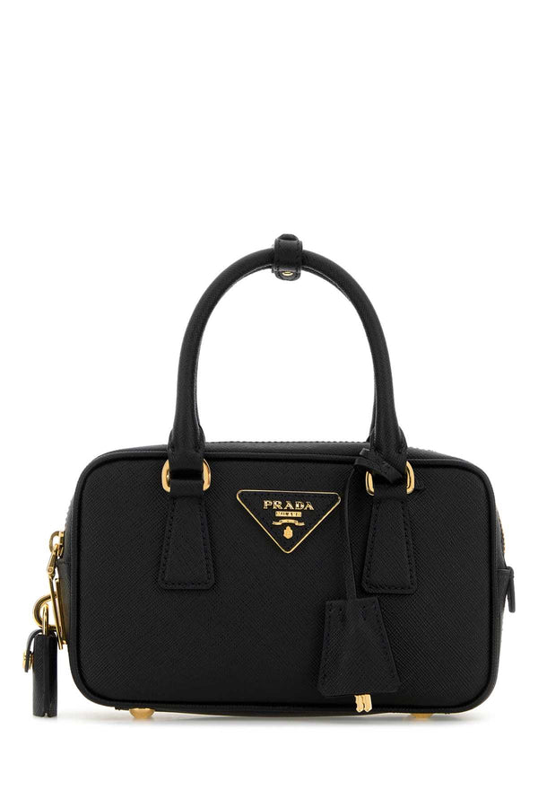 Prada Exterior: 100% Leather; Lining: 100% Fabric; Finishing: Golden metal top handle bag in black