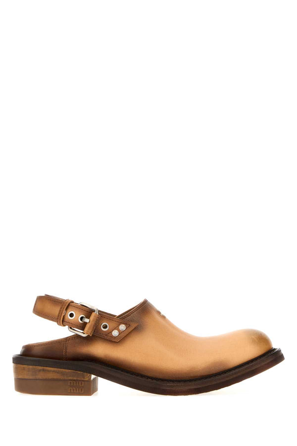 Miu Miu Exterior: 100% Calf; Interior: 10% Leather; Sole: Rubber clog in camel