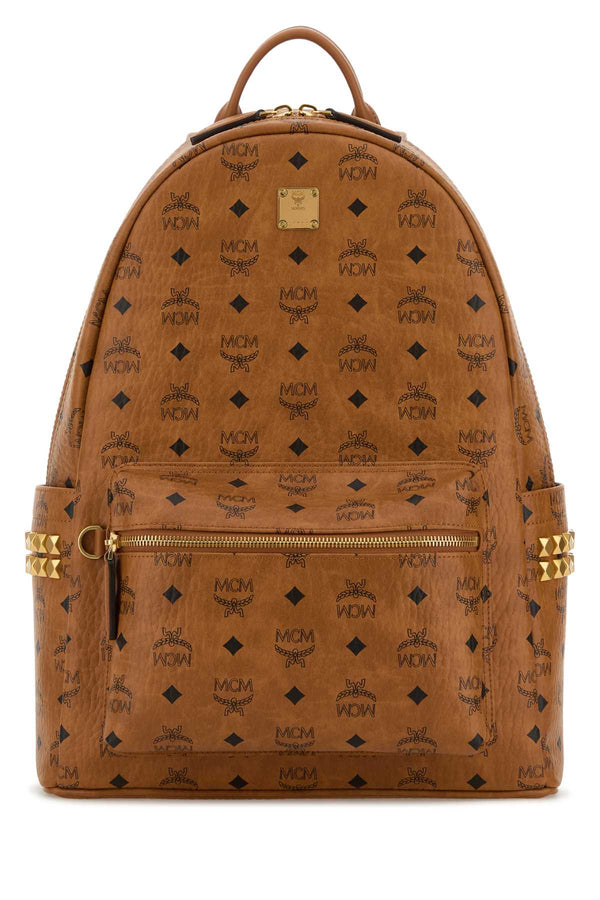 MCM Backpack Exterior: 100% Fabric; Lining: 100% Fabric; Finishing: Golden metal backpack in cognac