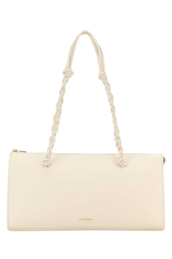 Jil Sander Exterior: 100% Calf Finishing: Golden metal shoulder bag in beige