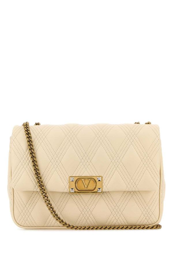 Valentino Garavani Quiltie Exterior: 100% Nappa leather; Lining: 100% Nappa leather; Finishing: Antiqued golden brass shoulder bag in beige