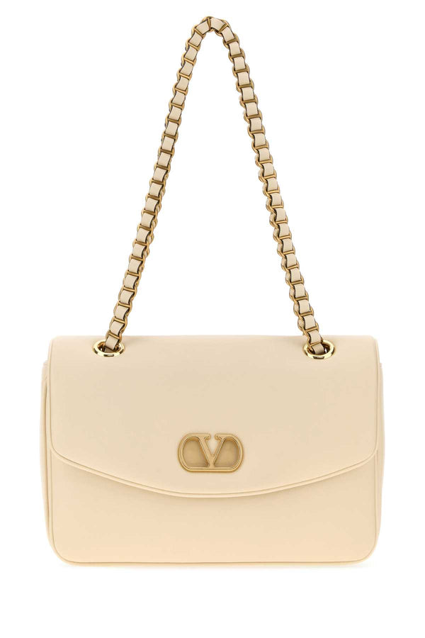 Valentino Garavani Djuna Exterior: 100% Leather; Lining: 100% Leather; Finishing: Golden metal shoulder bag in beige